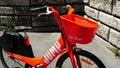 JUMP logo on UBER red bicycles. Bike sharing service integrated in the app