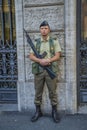 Rome - June 18, 2014 : An Italian police officer is standing on the street with a machine gun
