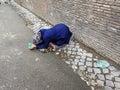 Rome - kneeling beggar