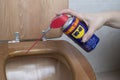 Water repellent WD 40 for cleaning encrusted waste
