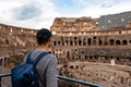 Rome - Man tourist with view on the interior of Colosseum of city of Rome, Lazio, Italy, Europe. UNESCO World Heritage Site Royalty Free Stock Photo