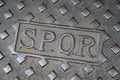 Rome manhole cover with the sigil of Senatus Populusque Romanus Royalty Free Stock Photo