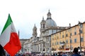 Rome, Navona Square, May 18th 2016: crowded day. Italian flag on the left