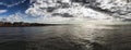 Rome panoramic seascape blow-up with awesome dramatic sky with mammatus clouds and corrugated sea hit by sun rays with cliff and Royalty Free Stock Photo