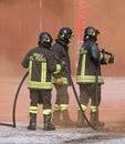 Rome, RM, Italy - May 23, 2019: three brave Firefighters with un Royalty Free Stock Photo