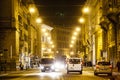 Rome road at night, urban traffic and citylife. Italy