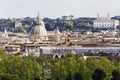 Rome`s glimpse with a beautiful dome surrounded by ancient buildings and monuments