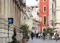 Rome str and Castelvecchio watchtower with the clock, Verona, It