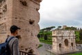 Rome - Tourist man looking from Colosseum with view on Triumphal Arch of Constantine inr Rome, Europe. Royalty Free Stock Photo