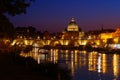Rome twilight view St. Peter dome, Tiber river and St. Angel bridge