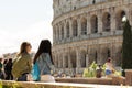 Rome, Two girls look at the Colosseum.