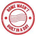 ROME WASN`T BUILT IN A DAY text on red round postal stamp sign