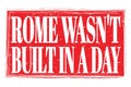 ROME WASN`T BUILT IN A DAY, words on red grungy stamp sign Royalty Free Stock Photo