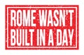 ROME WASN`T BUILT IN A DAY, words on red rectangle stamp sign Royalty Free Stock Photo