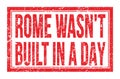 ROME WASN`T BUILT IN A DAY, words on red rectangle stamp sign Royalty Free Stock Photo