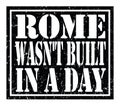 ROME WASN`T BUILT IN A DAY, text written on black stamp sign Royalty Free Stock Photo