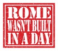 ROME WASN`T BUILT IN A DAY, text written on red stamp sign