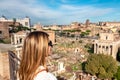 Rome - Woman with panoramic view on the Roman Forum and Rome Skyline from the Palatine Hill in the ancient city of Rome, Lazio Royalty Free Stock Photo