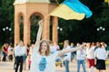 Romny, Sumy region, Ukraine. Youth Day, June 29, 2014. A girl in a national Ukrainian costume in an embroidered dress holds a