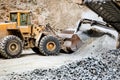 ron ore mining details. Industrial machinery working with rock breaker and crusher, dumper trucks Royalty Free Stock Photo