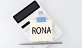 RONA text on the sticker on the white calculator