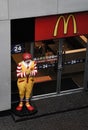 Ronald McDonald in front of the McDonalds restaurant. McDonald`s clown mascot stands to greet the public with a Thai homage.