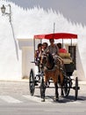 RONDA, ANDALUCIA, SPAIN - MAY 8 : Tourists enjoying a ride in a horse drawn carriage in Ronda Spain on May 8, 2014. Unidentified Royalty Free Stock Photo