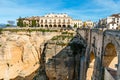 El Tajo Gorge Canyon with new bridge and white spanish houses in Ronda, Andalusia, Spain