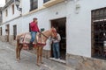 Man riding horse on street of Ronda, Spain