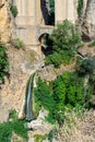 Waterfall under Puente Nuevo Bridge at sunset in Ronda Royalty Free Stock Photo