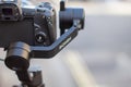 Ronin stabilizer and camera overlooking a blurry street