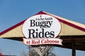 Buggy Rides at Red Caboose Motel Sign