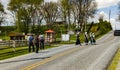 Teenage Amish Boys and Girls Walking Along a Rural Road