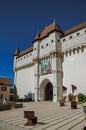 Ront view of Annecy castle with stone arch and square