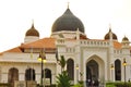 Ront view of the Kapitan Keling Mosque during sunset