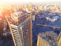 Rood of high tower building construction site. Bug industrial crane. Aerial drone view. Metropolis city development Royalty Free Stock Photo