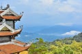 The roof of ancient building Asia style on a natural of mountain and sky background. Royalty Free Stock Photo