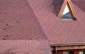 Roof Asphalt Shingles and Attic Mansard Window. Roofing Construction. Roofing Repair. Rain gutter Royalty Free Stock Photo