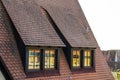 Roof attic windows in old tiled european house Royalty Free Stock Photo