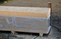 Roof battens beams and osb boards intended for construction lie unwrapped on the ground on a pallet. The slats are painted with th Royalty Free Stock Photo