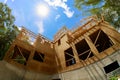 A roof on built new home residential construction house framing against a blue sky Royalty Free Stock Photo