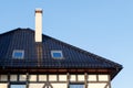 Roof of black glazed ceramic tiles with Dormer Windows and ventilation pipe