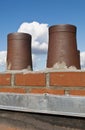 Roof and brick smoke stack Royalty Free Stock Photo