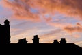 Roof of a building in a shadow during scenic pink sunset Royalty Free Stock Photo