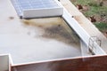 The roof of building wet from spilled water because of rainy day