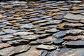 Roof built from shale stones, ancient masonry, village Dartlo Tusheti region, Georgia. Background rough texture