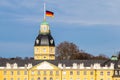Roof of Castle Karlsruhe, with German Flag at Halfmast, auf Halbmast, on the tower roof in winter. In Baden-WÃÂ¼rttemberg, Germany Royalty Free Stock Photo
