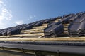 Roof ceramic tile arranged in packets on the roof on roof battens. Preparation for laying roof tiles.