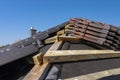 Roof ceramic tile arranged in packets on the roof on roof battens. Preparation for laying roof tiles. Royalty Free Stock Photo