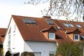 Roof of classic residential houses with orange roofing tiles and